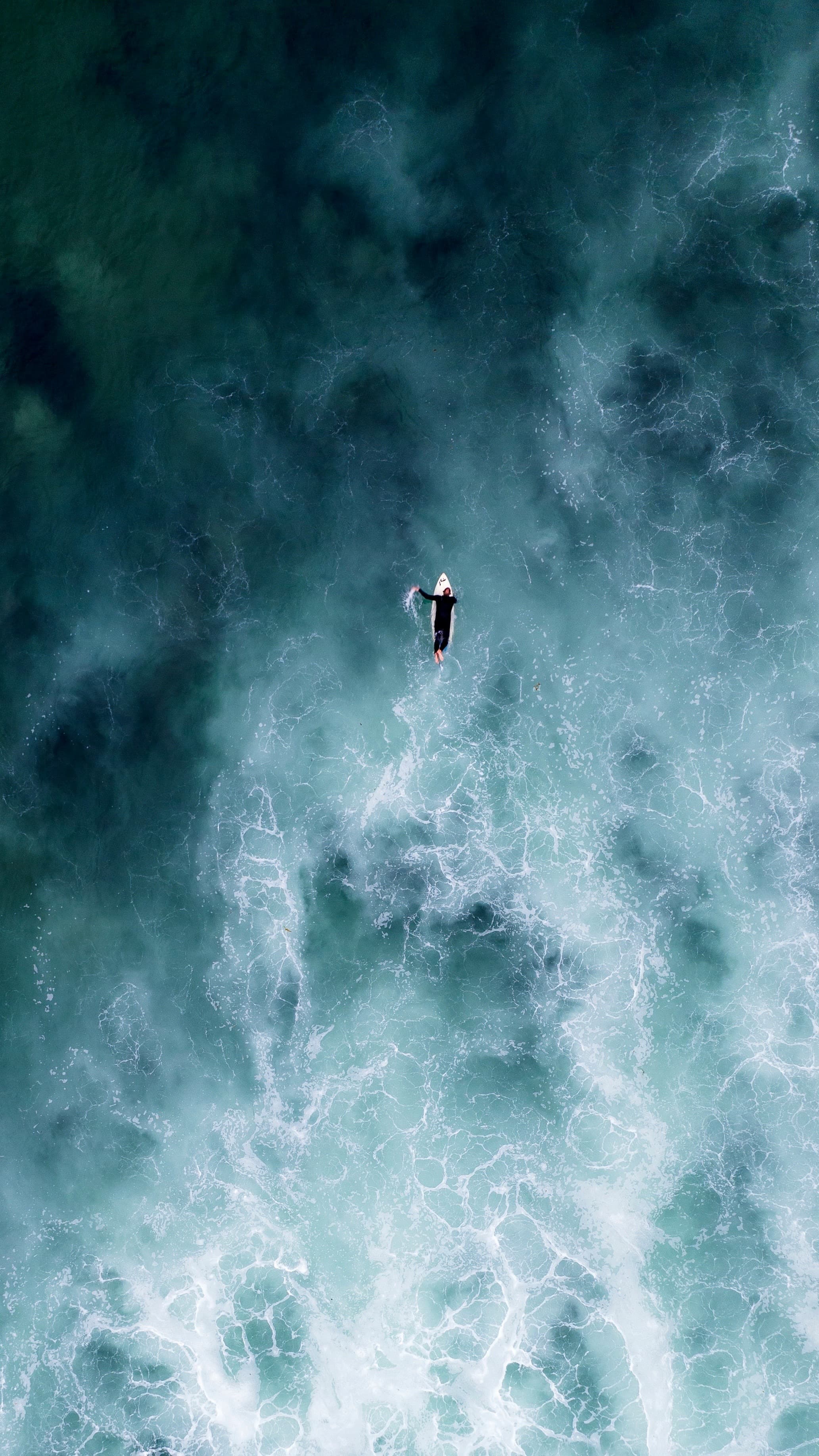 Aerial view of surfer on the ocean